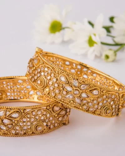 indian-traditional-wedding-jewellery-bangles-with-huldi-kumkum-white-flowers-selective-focus_466689-67781.jpg